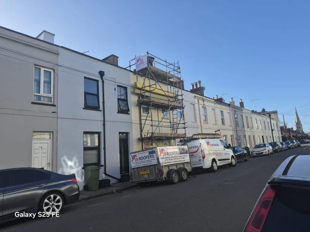 JS Roofers van and scaffolding on a Cheltenham terrace roof job